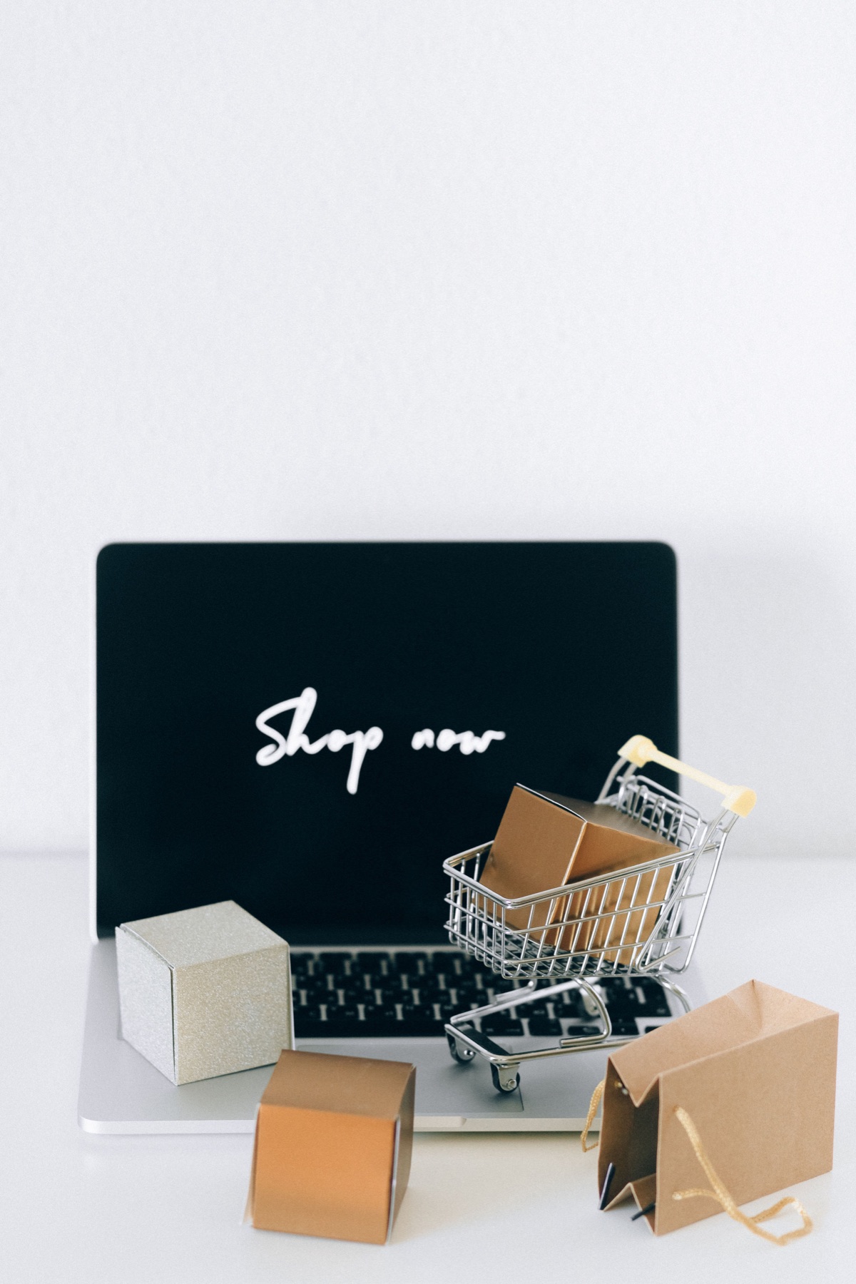 Illustrative online shopping display with a laptop and parcels